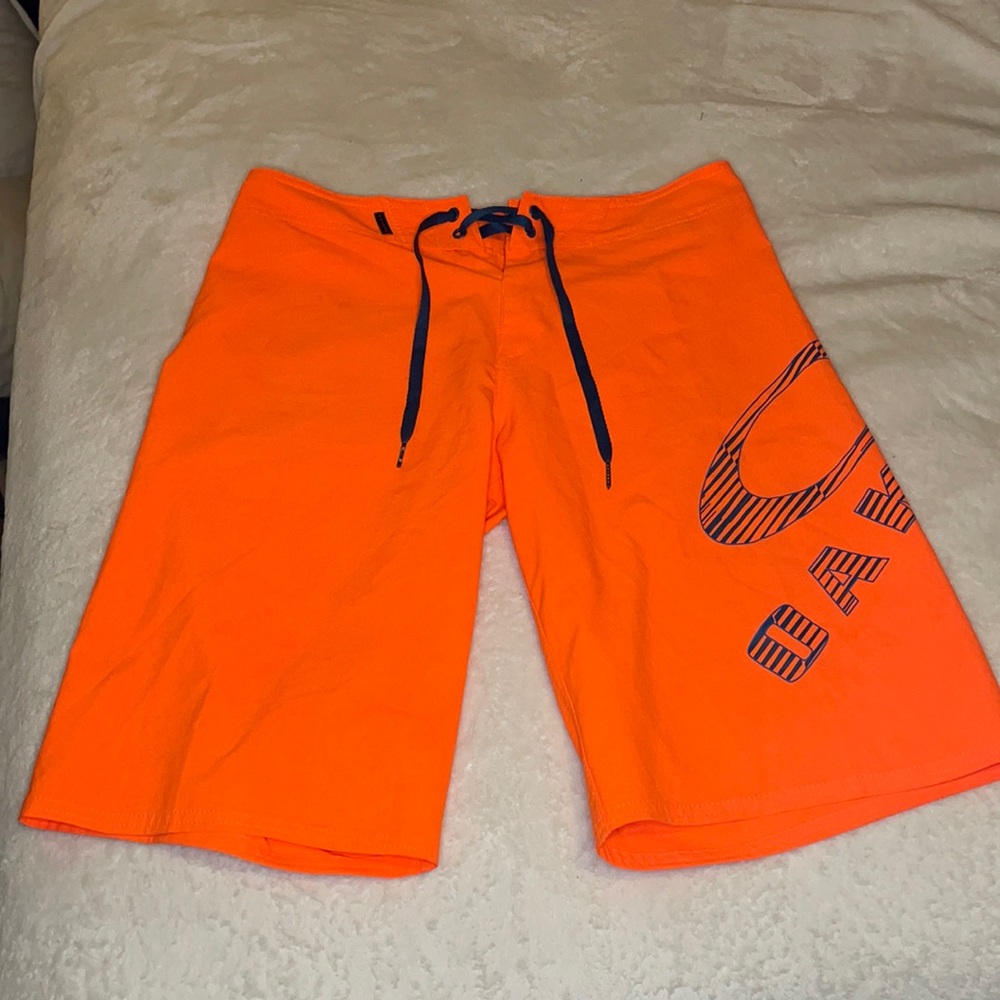 Orange Oakley board shorts/Swim Trunks
